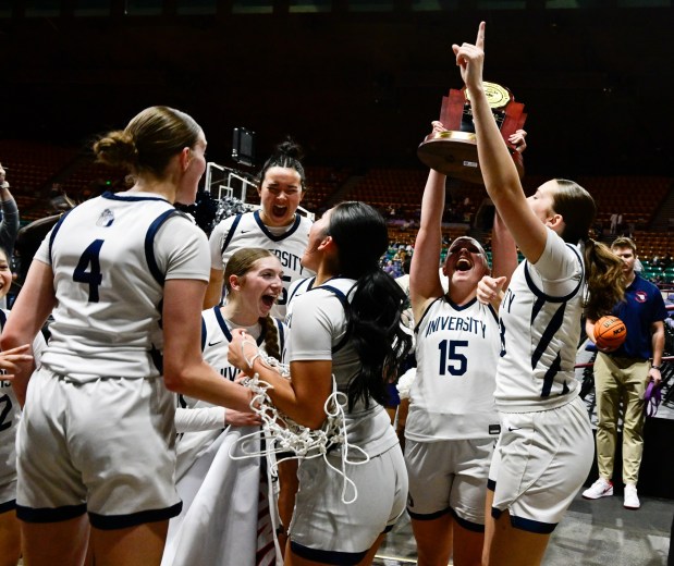 The University Bulldogs celebrate after defeating the the Delta Panthers 42-35, winning the state high school girls 4A championship game against the Delta Panthers at the Denver Coliseum in Denver, Colorado on Saturday, March 15, 2025. (Photo by Andy Cross/The Denver Post)