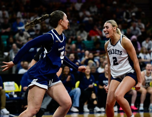Kinley Asp (2) of the Air Academy Kadets reacts after swatting the ball away from Keaton Arangua-Egbert (5) of the Mullen Mustangs in the first half of the state high school girls Class 5A championship game at the Denver Coliseum in Denver on Saturday, March 15, 2025. (Photo by Andy Cross/The Denver Post)