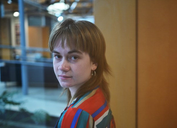 Sarah Napier, one of eight Coloradans arrested during pro-Palestine protests on Denver's Auraria campus last year, is part of a group now suing members of the Auraria Campus Police Department, alleging the arrests were unlawful and violated their free speech rights. Napier stands for a photo at their attorney's office, Rathod Mohamedbhai LLC in Denver on April 8, 2025.(Photo by RJ Sangosti/The Denver Post)