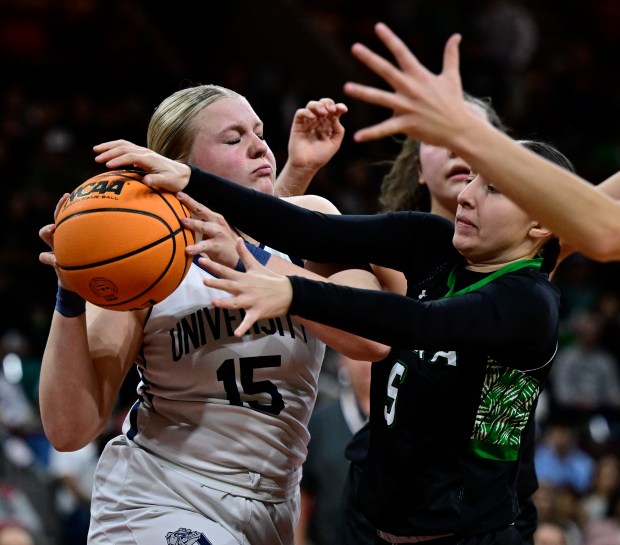 Addison Harding (15) of the University Bulldogs battles Jazlyn Naranjo (5) of the Delta Panthers after a defensive rebound in the first half of the state high school girls 4A championship game at the Denver Coliseum in Denver on Saturday, March 15, 2025. (Photo by Andy Cross/The Denver Post)