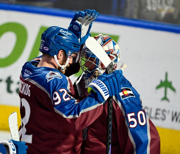 Colorado Eagles forward Gabriel Landeskog (92) greets goalie Trent Minor (50) after the Eagles defeated the Henderson Silver Knights in the third period at Blue Arena in Loveland, Colorado on Friday, April 11, 2025. (Photo by Andy Cross/The Denver Post)