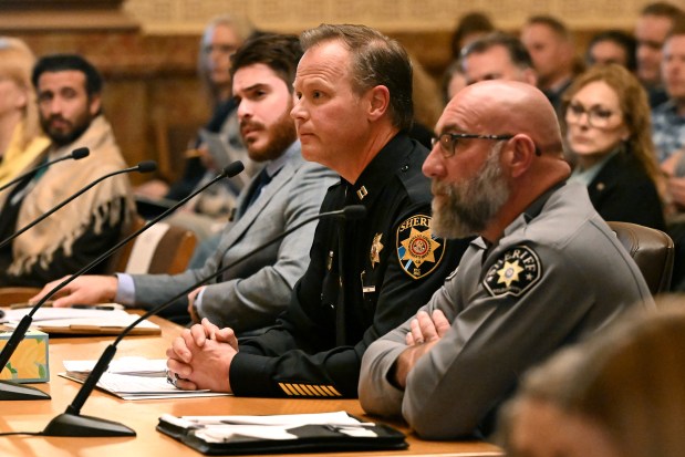 Capt. Jason Kennedy with the Douglas County Sheriff's office, center, sitting next to Weld County Sheriff Steve Reams, right, gives his testimony to members of the Senate's State, Veterans & Military Affairs Committee as they consider Senate Bill 3 in the Old Supreme Court Chamber in the Colorado State Capitol in Denver on Jan. 28, 2025. The committee held a first vote on the measure, which would effectively enact a ban on a wide swap of weapons considered assault weapons. The bill is up for its first committee vote in the Capitol. The committee lasted well into the evening with proponents and opponents of the bill allowed to give their testimony to the members of the committee. SB3 is a new approach to limiting the sale of high-powered, semiautomatic firearms -- instead of outright banning specific types of weapons, it would ban weapons that accept a detachable magazine. That would cover many of the weapons we consider assault weapons. Given that the bill is sponsored by state Sen. Tom Sullivan, whose opposition to similar legislation in the past has sunk it, it's also very likely to pass the chamber and the legislature this year. (Photo by Helen H. Richardson/The Denver Post)