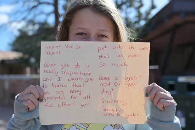 Annalise Sturgis, 12, shows her card for park rangers at Rocky Mountain National Park's Beaver Meadows Visitor Center in Estes Park, Colorado, on Wednesday, March 5, 2025. (Photo by Hyoung Chang/The Denver Post)