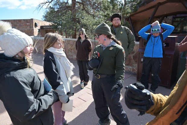 Park ranger Belen del Valle Coello, center, welcomes students at Rocky Mountain National Park's Beaver Meadows Visitor Center in Estes Park, Colorado, on Wednesday, March 5, 2025. (Photo by Hyoung Chang/The Denver Post)