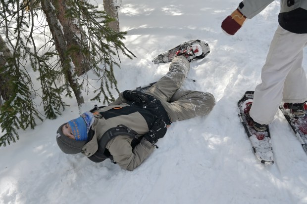 Finn Houghton, 12, reacts after falling in snow on Bear Lake Trail in Rocky Mountain National Park, Colorado, on Wednesday, March 5, 2025. (Photo by Hyoung Chang/The Denver Post)
