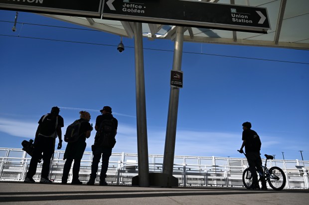 People wait for a Regional Transportation District light rail train in Lakewood on March 10, 2025. (Photo by Helen H. Richardson/The Denver Post)