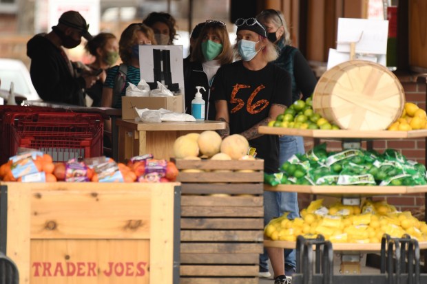 DENVER, CO - MARCH 9 : People are in the line for grocery shopping at Trader Joe's in Denver, Colorado on Tuesday, March 9, 2021. (Photo by Hyoung Chang/The Denver Post)
