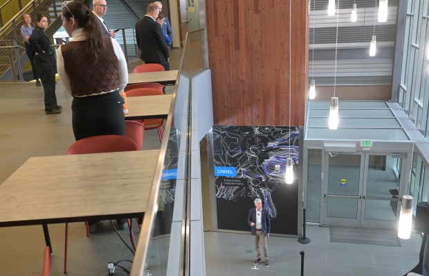 U.S. Secretary of Energy Chris Wright speaks with the media during his visit to the Department of Energy's National Renewable Energy Laboratory (NREL) campus in Golden, Colorado, on April 3, 2025. NREL employees listen as they pass by upstairs. (Photo by RJ Sangosti/The Denver Post)