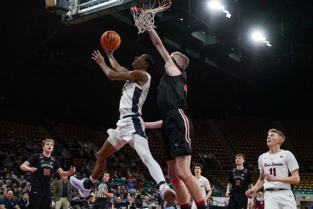 Kent Denver's Elvis Lloyd (2) is defended by Colorado Academy's Mikel Miller (23) during the Colorado High School Boy's Basketball 4A State Championship game at Denver Coliseum, Saturday, March 15, 2025, in Denver. Kent Denver High School's Boy's Basketball team won 71-54. (Rebecca Slezak/Special to The Denver Post).