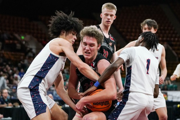 Kent Denver's Caleb Fay (13 and Devan Johnson (1) fight with Colorado Academy's James Claypool (24) for the ball during the Colorado High School Boy's Basketball 4A State Championship game at Denver Coliseum, Saturday, March 15, 2025, in Denver. Kent Denver High School's Boy's Basketball team won 71-54. (Rebecca Slezak/Special to The Denver Post).