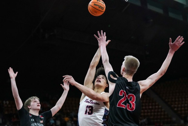 Kent Denver's Caleb Fay (13) shoots the ball around Colorado Academy's Mikel Miller (23) during the Colorado High School Boy's Basketball 4A State Championship game at Denver Coliseum, Saturday, March 15, 2025, in Denver. Kent Denver High School's Boy's Basketball team won 71-54. (Rebecca Slezak/Special to The Denver Post).