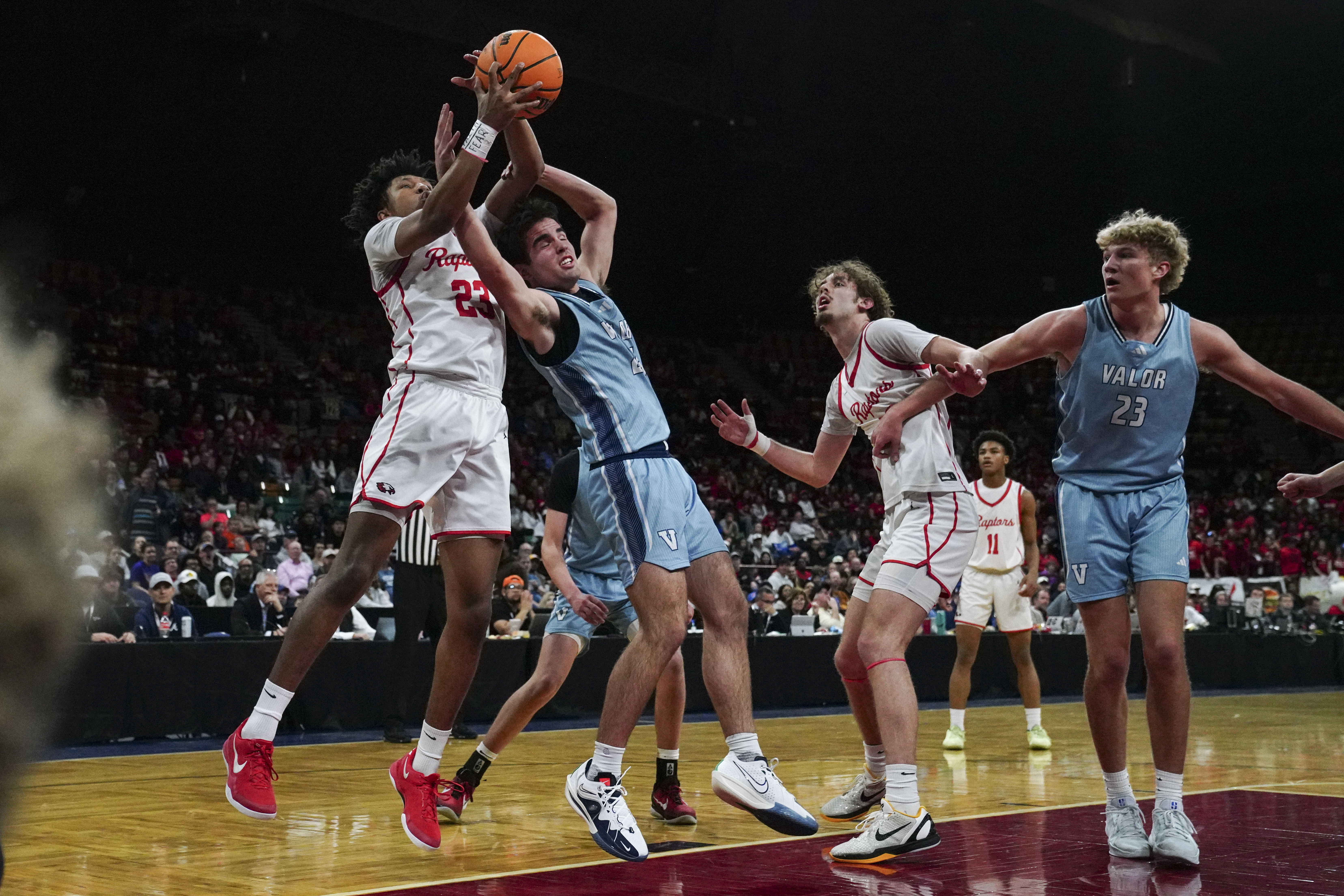 Eaglecrest's La'Quince York (23) and Valor Christian's Ryan Mandes (24) battle for the ball during the Class 6A Boy's Basketball State Championship game at Denver Coliseum, Saturday, March 15, 2025, in Denver. Eaglecrest High School's Boy's Basketball team won 65-63. (Rebecca Slezak/Special to The Denver Post).