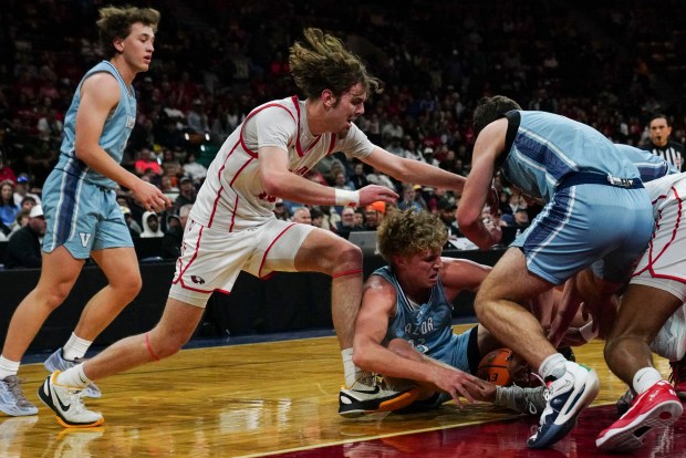 Eaglecrest High School's Boy's Basketball team and Valor Christian High School's Boy's Basketball team battle for possession of the ball during the Class 6A Boy's Basketball State Championship game at Denver Coliseum, Saturday, March 15, 2025, in Denver. Eaglecrest High School's Boy's Basketball team won 65-63. (Rebecca Slezak/Special to The Denver Post).