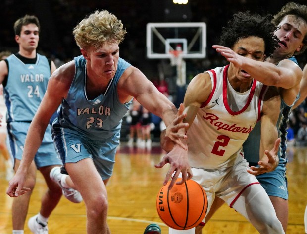 Valor Christian's Brady Wynja (23) and Cole Scherer (1) defend Eaglecrest's Lucas Kalimba (2) during the Class 6A Boy's Basketball State Championship game at Denver Coliseum, Saturday, March 15, 2025, in Denver. Eaglecrest High School's Boy's Basketball team won 65-63. (Rebecca Slezak/Special to The Denver Post).