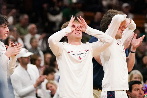 Kent Denver High School's bench reacts to them scoring a three-pointer during the Colorado High School Boy's Basketball 4A State Championship game at Denver Coliseum, Saturday, March 15, 2025, in Denver. (Rebecca Slezak/Special to The Denver Post).