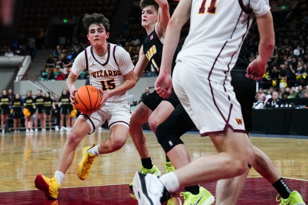 Windsor High School's Brady Kingsley (15) drives the ball around Green Mountain's Sam Mielenz (1) during the Class 5A Boy's Basketball State Championship game at Denver Coliseum, Saturday, March 15, 2025, in Denver. Windsor won 60-49 against Green Mountain. (Rebecca Slezak/Special to The Denver Post).