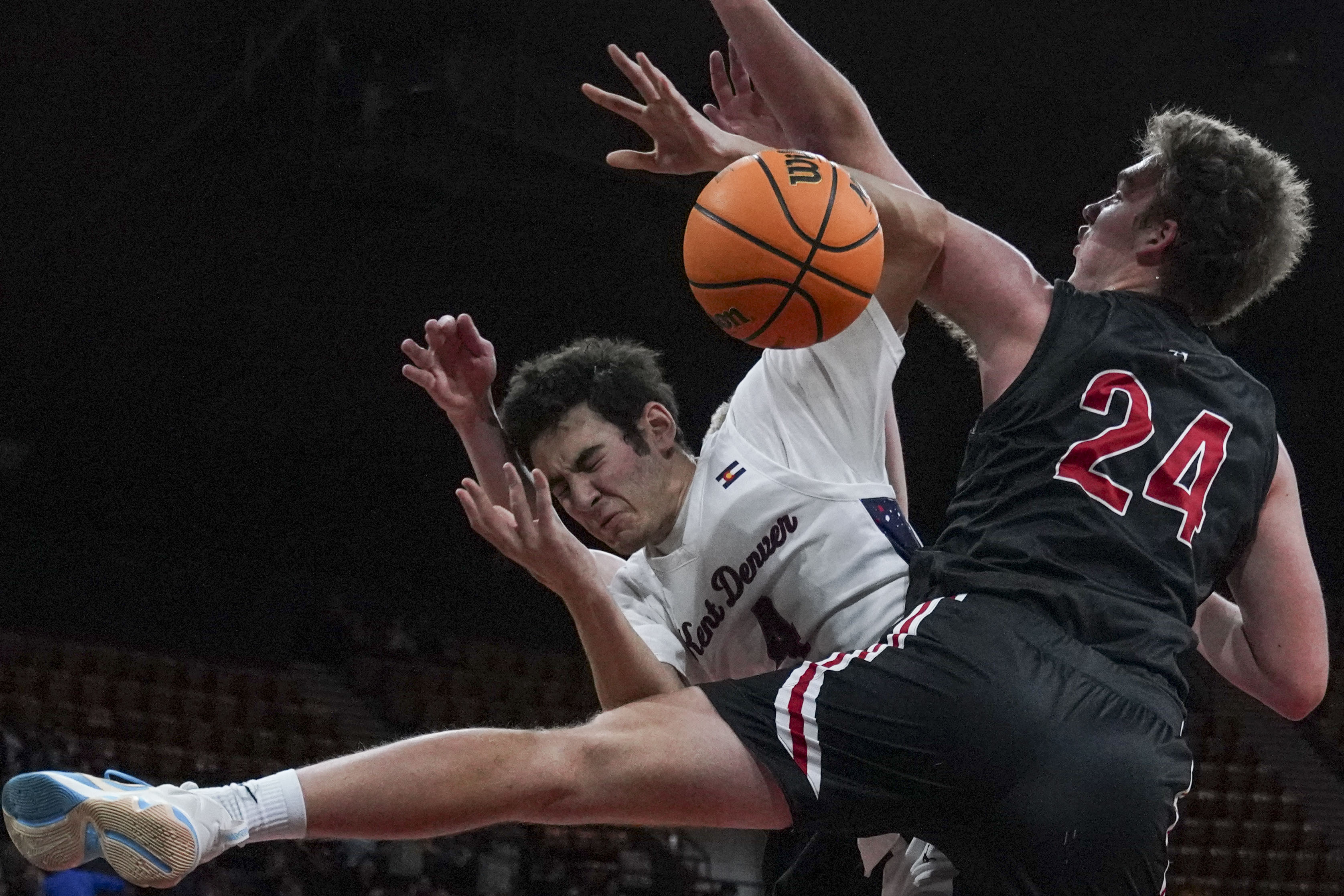 Kent Denver's Gil Schayes (4) is defended by Colorado Academy's James Claypool (24) during the Colorado High School Boy's Basketball 4A State Championship game at Denver Coliseum, Saturday, March 15, 2025, in Denver. Kent Denver High School's Boy's Basketball team won 71-54. (Rebecca Slezak/Special to The Denver Post).