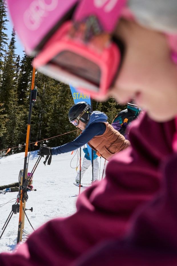 Sarah Tubbs and her daughter Afton Tubbs, foreground, with the Hinsdale Ski Team, line up to race during the Mardis Gras Fun Race at Wolf Creek Ski Area on March 1, 2025. (Photo by Jacob Spetzler/Special to The Denver Post)