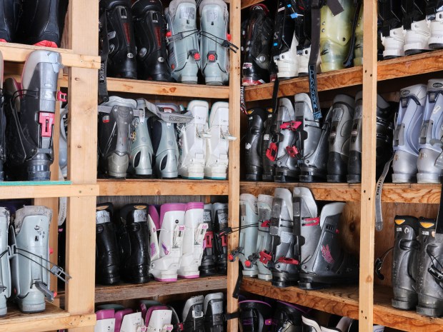 Boots line the walls of the lodge at the Lake City Ski Hill on Feb. 24, 2025. Hinsdale Ski Team membership comes with free rentals which removes a major barrier to learning to ski. (Photo by Jacob Spetzler/Special to The Denver Post)