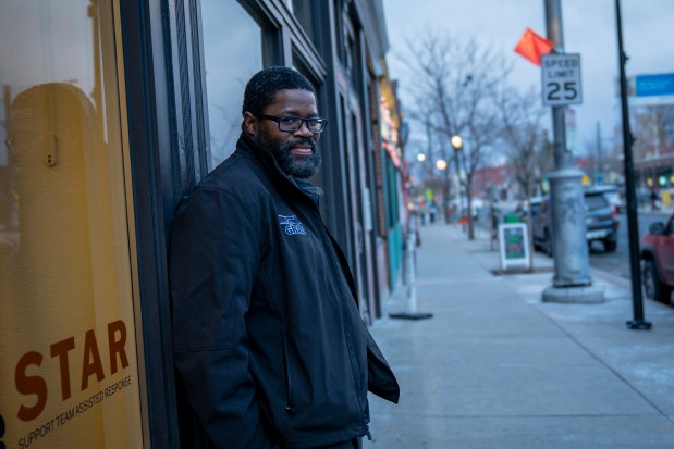 Jerry Morgan, AIM's lead outreach worker, stands outside the REACH Clinic in Denver's Five Points neighborhood. He's done the work for about nine years and says he's seen an escalation of violence among young people during that time, especially since the COVID-19 pandemic. "Facebook beefs became real beefs. Everybody wanted to fight. Everybody wanted to shoot," he says. (Stephanie Wolf for KFF Health News)